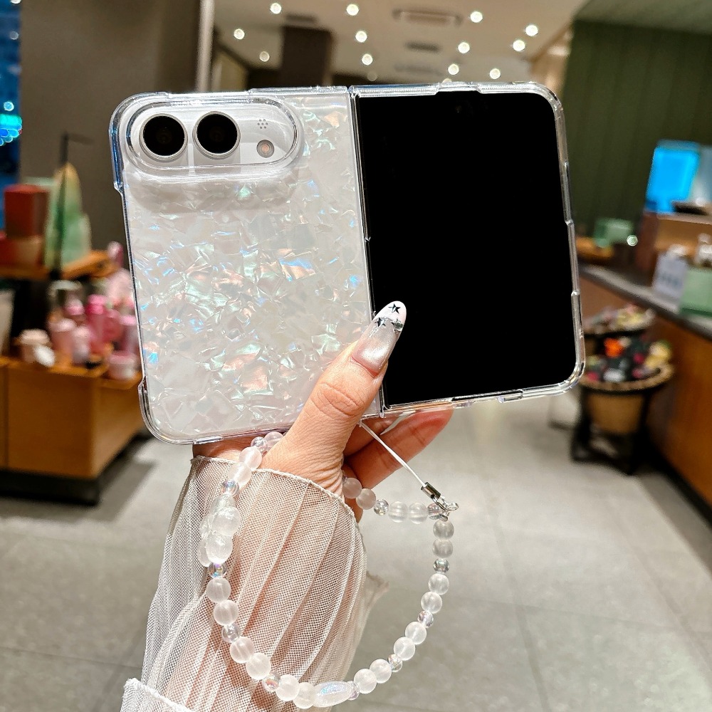 Camera Wrist Strap - เคสโทรศัพท์แข็งลายเปลือกหอยเหลือบรุ้งสำหรับ iPhone Duo พร้อมสายคล้องข้อมือประดับลูกปัดลายดอกไม้ พื้นที่ตัดกล้องขนาดใหญ่ เคสป้องกัน